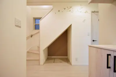 a living room with a large closet under the stairs at Magical Dream House ★ Maihama - Vacation STAY 12402 in Tokyo