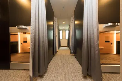 a corridor in a hospital with curtains on the walls at Ryoma Ikebukuro female only Guest House Vacation STAY 16032v in Tokyo