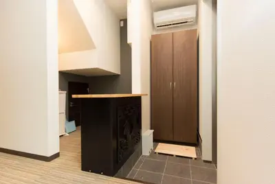 a living room with a fireplace and a staircase at Ryoma Ikebukuro female only Guest House Vacation STAY 16032v in Tokyo