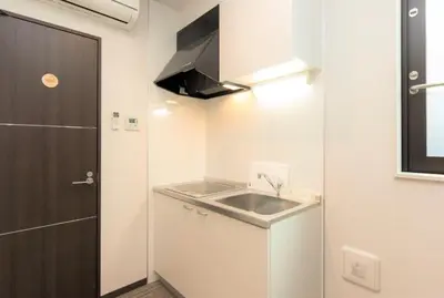 a small kitchen with a sink and a stove at Ryoma Ikebukuro female only -Guest House- Vacation STAY 16045v in Tokyo