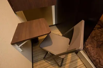 a desk and a chair sitting next to a table at Ryoma Ikebukuro male only -Guest House - Vacation STAY 14547v in Tokyo