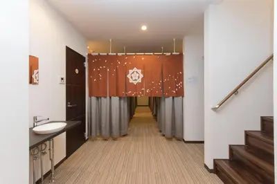 a bathroom with a curtain and a sink and stairs at Ryoma Ikebukuro male only -Guest House - Vacation STAY 14547v in Tokyo