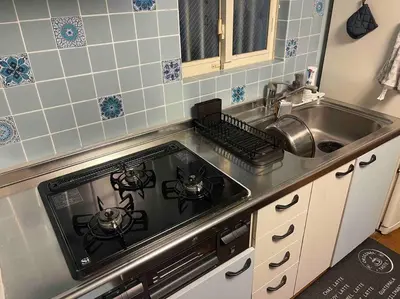 a kitchen with a stove and a sink at M&Ks house in Tokyo
