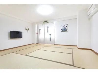an empty room with white walls and a flat screen tv at Hotel Hanabi - Vacation STAY 67147v in Tokyo