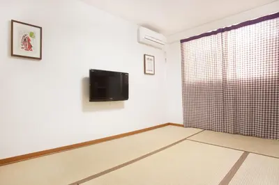 a room with a flat screen tv on a wall at Hotel Hanabi - Vacation STAY 89107v in Tokyo