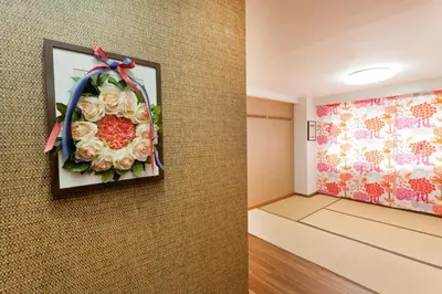a room with a painting of flowers on the wall at Hotel Hanabi - Vacation STAY 89136v in Tokyo