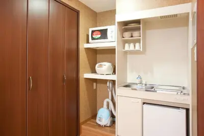 a small kitchen with a sink and a cabinet at Hotel Hanabi - Vacation STAY 89124v in Tokyo
