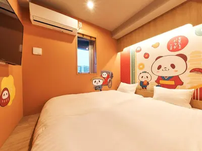 a bedroom with a large bed with a hello kitty wallpaper at Rakuten STAY Tokyo Asakusa in Tokyo