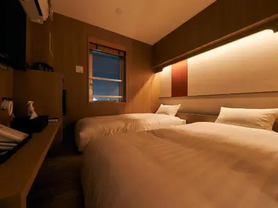 a hotel room with two beds and a window at Rakuten STAY Tokyo Asakusa in Tokyo