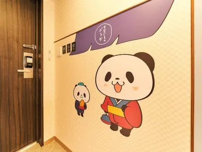a wall sticker of a panda holding a book and a doll at Rakuten STAY Tokyo Asakusa in Tokyo