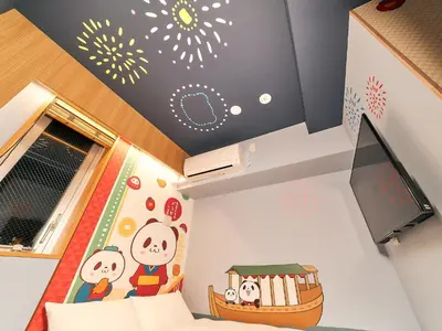a bedroom with a childrens bedroom with a cartoon wallpaper at Rakuten STAY Tokyo Asakusa in Tokyo