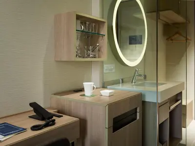 a bathroom with a sink and a mirror at Millennium Mitsui Garden Hotel Tokyo - Ginza in Tokyo