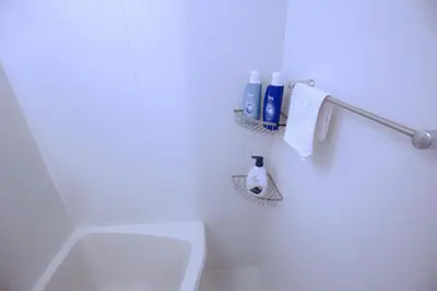 a white bathroom with a white toilet and towels at Shinjuku Ryokan Retreat丶Local Tokyo Experience & Short Trips Hub丶walk to Higahsi Shinjuku station YEoL in Tokyo