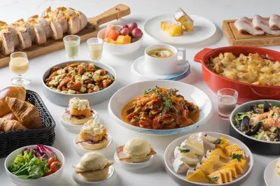a table topped with lots of different dishes of food at Premier hotel -CABIN PRESIDENT- Tokyo in Tokyo