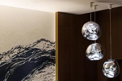 three glass lights hanging from a wall in a room at Premier hotel -CABIN PRESIDENT- Tokyo in Tokyo