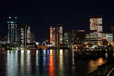 a view of a city at night with the water at Premier hotel -CABIN PRESIDENT- Tokyo in Tokyo