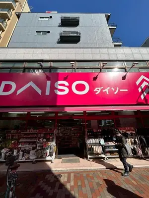 a person walking past a store with a pink sign at -Hirai- 10 minutes' walk from Hirai Station Direct service to Shinjuku and Akihabara 平井戸建 in Tokyo