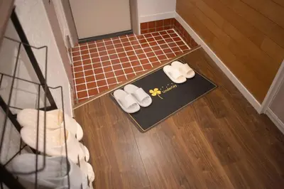 an overhead view of two pairs of shoes on a floor at \u94f6\u5ea7\u5408\u4e4b\u5c4b \u7b51\u5730\u5e02\u573a\u5730\u94c1\u4e09\u5206\u949f \u94f6\u5ea7\u5f92\u6b65\u5341\u5206\u949f in Tokyo