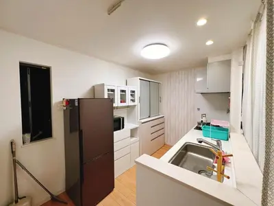a kitchen with a sink and a refrigerator at JINGHOUSE高砂（無料駐車場）一戸建て 上野/浅草/银座/天空树 in Tokyo