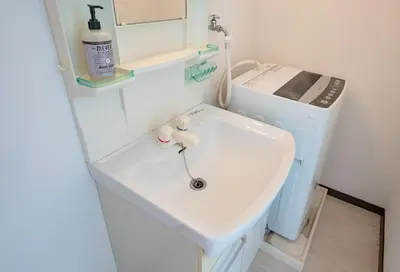 a bathroom with a sink and a washing machine at Princet Shinjuku Building - Vacation STAY 15549 in Tokyo