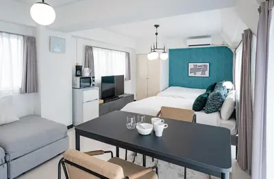 a hotel room with a bed and a table and chairs at Princet Shinjuku Building - Vacation STAY 15549 in Tokyo
