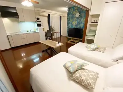 a small room with two beds and a kitchen at Regalia Hills Shibuya Dogenzaka - Vacation STAY 15550 in Tokyo