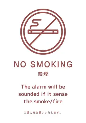 a sign that reads no smoking the alarm will be sounded if it sense the smoke at Meguro Apartment in Tokyo