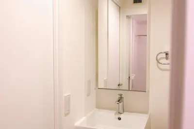 a white bathroom with a sink and a mirror at \u5922\u306e\u820e Asakusa Horizon Bleu in Tokyo