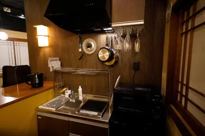 a small kitchen with a sink and a microwave at HOTEL Lee in Tokyo