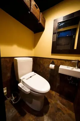 a bathroom with a toilet and a sink at HOTEL Lee in Tokyo