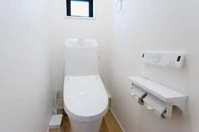 a bathroom with a white toilet and a sink at Shinjuku City House \u65b0\u5bbf\u30b7\u30c6\u30a3\u30cf\u30a6\u30b9 in Tokyo