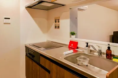 a kitchen with a sink and a counter top at ACOE ASAKUSA - 3 minutes from station in Tokyo