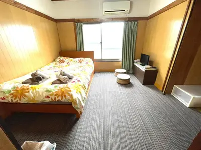 a hotel room with a bed and a television at Tokyo Stay Kitashinjyuku in Tokyo