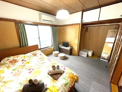a hotel room with a bed with towels on it at Tokyo Stay Kitashinjyuku in Tokyo