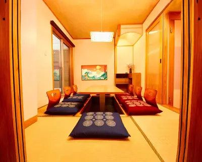 a room with chairs and a table in a room at TokyoKoso Vacation Home in Tokyo