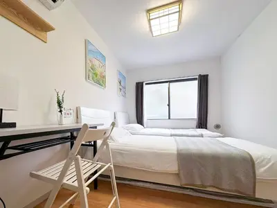 a white bedroom with a bed and a desk at 7\u6642IN19\u6642OUT # \u65b0\u5bbf\u6b4c\u821e\u4f0e\u753a\u30a8\u30ea\u30a2\u307e\u3067\u96fb\u8eca4\u5206 # \u99c5\u8fd18\u5206 # \u5c02\u7528\u30d0\u30b9\u30ad\u30c3\u30c1\u30f3 # \u6700\u59273\u540d # 7 00 IN19 00 OUT # 4 min train to Shinjuku Kabukicho # 8 min walk to station # Private bath kitchen # Max 3 in Tokyo