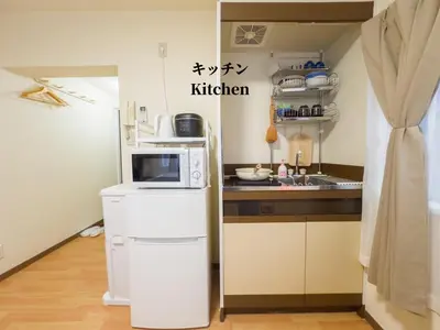 a kitchen with a microwave on top of a refrigerator at 7\u6642IN19\u6642OUT # \u65b0\u5bbf\u6b4c\u821e\u4f0e\u753a\u30a8\u30ea\u30a2\u307e\u3067\u96fb\u8eca4\u5206 # \u99c5\u8fd18\u5206 # \u5c02\u7528\u30d0\u30b9\u30ad\u30c3\u30c1\u30f3 # \u6700\u59273\u540d # 7 00 IN19 00 OUT # 4 min train to Shinjuku Kabukicho # 8 min walk to station # Private bath kitchen # Max 3 in Tokyo