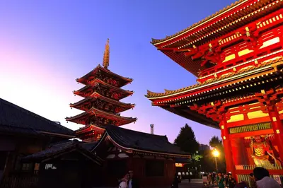 a group of pagodas with people standing next to them at \u5922\u306e\u820e \u6d45\u8349 Yumenoya Asakusa in Tokyo