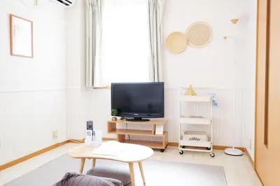 a living room with a television and a table at \u5922\u306e\u820e \u6d45\u8349 Yumenoya Asakusa in Tokyo