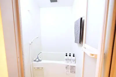 a white refrigerator in a room with a window at \u5922\u306e\u820e \u6d45\u8349 Yumenoya Asakusa in Tokyo