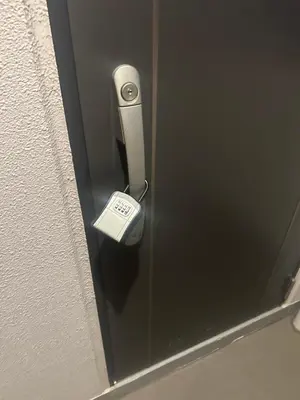 a door with a lock on a glass door at Tokyo Skytree Home Skytree View Hikifune in Tokyo