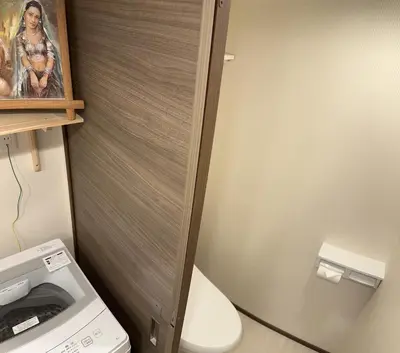 a small bathroom with a toilet and a washing machine at Shinjuku private homestay max 10ppl in Tokyo