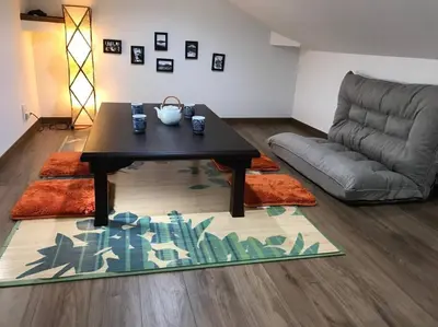 a living room with a table and a couch at Shinagawa New Apt Easy access to both Haneda & Narita Airport in Tokyo