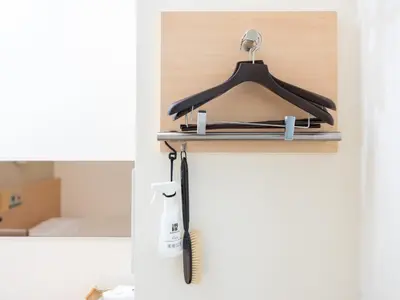 a towel rack hanging on the door of a bathroom at Super Hotel Asakusa in Tokyo