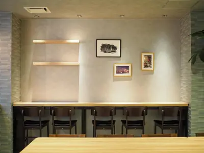 a bar in a restaurant with a bunch of chairs at Super Hotel Asakusa in Tokyo