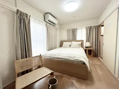 a bedroom with a bed and a large window at Tranquil house with 3 bedrooms 7min to metro straight to Shinjuku and Shibuya in Tokyo