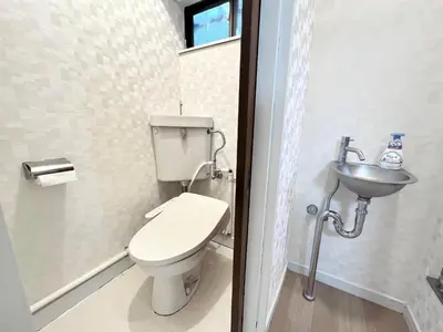 a bathroom with a toilet and a sink at Tranquil house with 3 bedrooms 7min to metro straight to Shinjuku and Shibuya in Tokyo