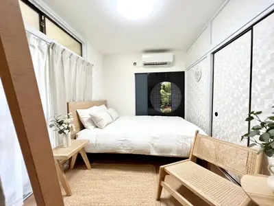 a small bedroom with a bed and a window at Tranquil house with 3 bedrooms 7min to metro straight to Shinjuku and Shibuya in Tokyo