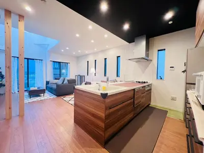 a kitchen with a sink and a living room at Zaki-House-EG0307 in Tokyo