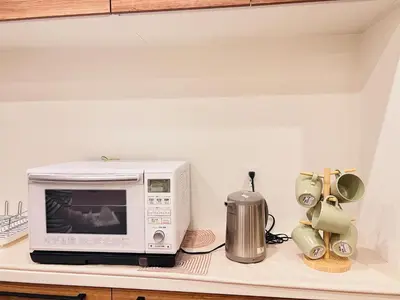 a kitchen counter with a microwave and a toaster at Zaki-House-EG0307 in Tokyo